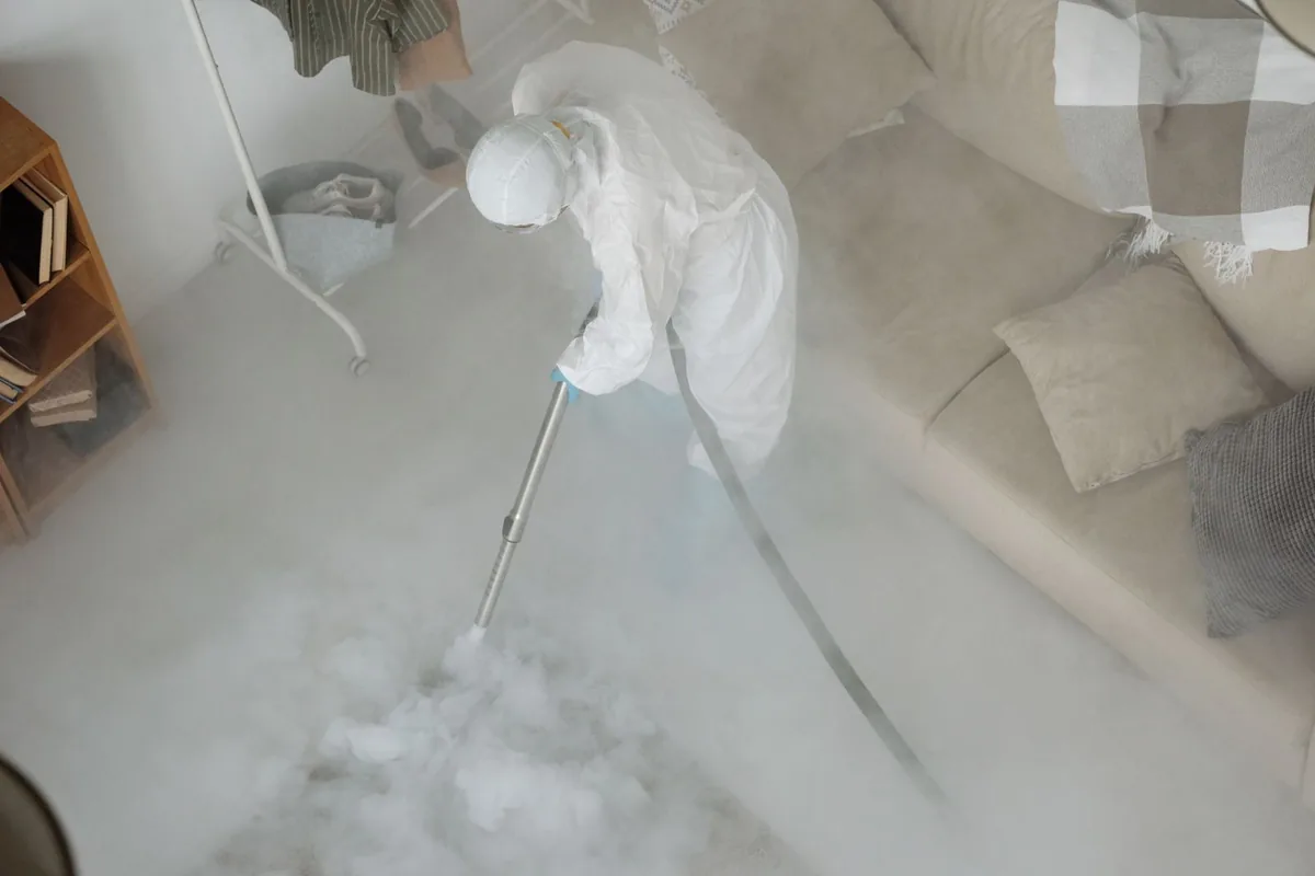 Biohazard cleanup technician in protective equipment, Junction City, KY